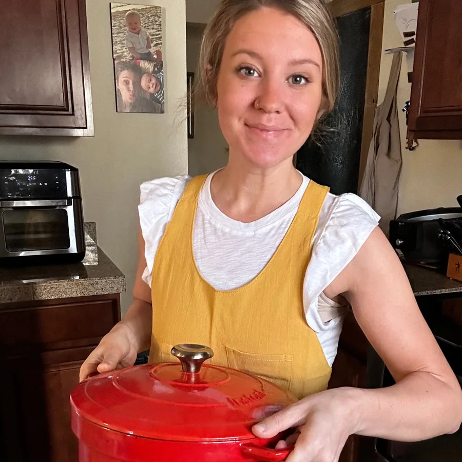 A Hanee community member cooking in a yellow apron